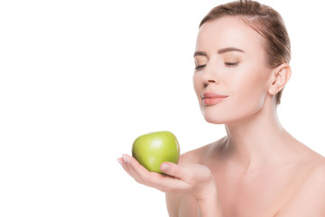 Portrait of woman with clean skin holding apple isolated on white