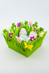 Baket with easter eggs on white background