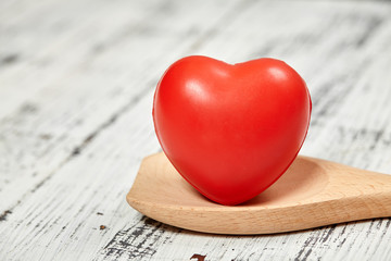 Red heart. Bright. On a wooden table. For your design. 