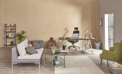 Wooden working table and grey sofa with green armchair furniture. Home office decoration.