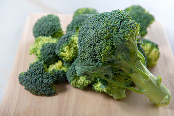 tasty broccoli on wooden board