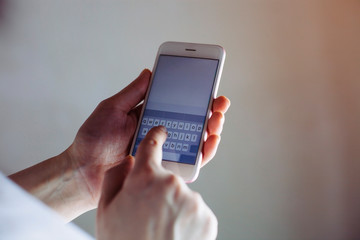 Manager holding mobile and texting message. Woman freelancer using smartphone for social network.