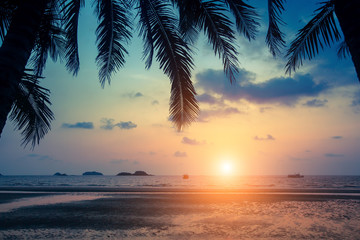 Naklejka na ściany i meble Tropical sea beach during amazing Sunset. .