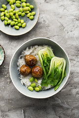 Healthy home cooking. Meat balls teriyaki, rice, cabbage bok choy bowl with sesame seeds in a ceramic dish. Top View.