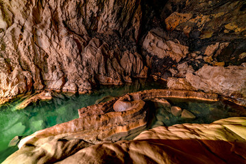 The dark and wet exploration of the beautiful Sumaguing Cave in the Philippians, Sagada, mountain...