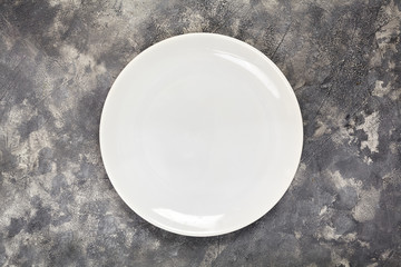 A white plate. An object. Clean. for food. View from above. For your design. Texture.