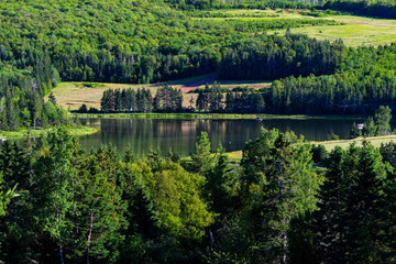 Obraz premium Slow river running through rural North America.