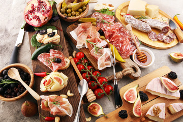Italian antipasti wine snacks set. Cheese variety, Mediterranean olives, pickles, Prosciutto di...
