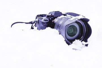 Camera set in the snow ready for shooting