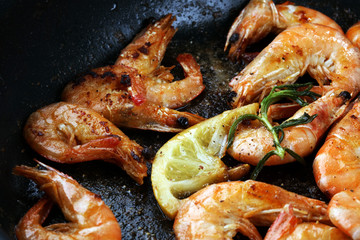 Grilled shrimp skewers. Seafood, shelfish. Shrimps Prawns skewers with herbs, garlic and lemon.