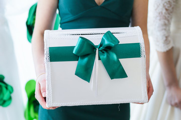 wedding box for storing money in the hands of a female witness