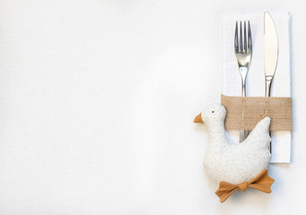 white napkin, knife and fork, place for dinner served in rustic style
