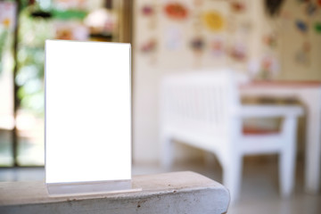 Menu frame space for text marketing promotion standing on wood table in Bar restaurant cafe.