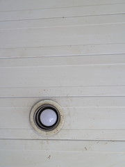 a lamp on a dirty ceiling