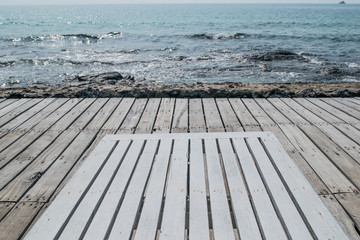 Fototapeta premium wooden beach chair on the floor at seaside