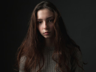 Naklejka premium Calm girl with long hair in studio