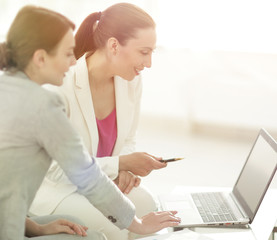 Naklejka premium women Bank employees in the office