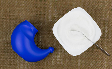 Purification of the nose. Neti is a pot washing device. On a dark background.