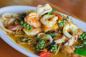 Close up Fried stir spicy shrimp squid  (sea food) ingredient  fingerroot  Fresh pepper  is thai food.