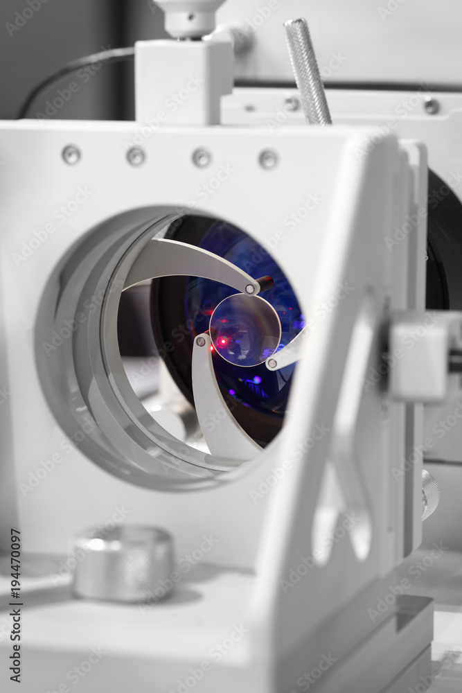 Poster red laser on optical table in physics laboratory, solid-state laser installation in physical laborat