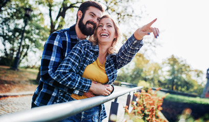 Meeting in the park. Romantic couple having fun in the park. Love, dating, romance