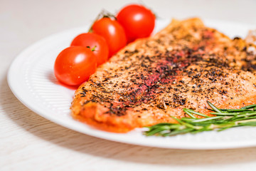 Roasted fish fillet with vegetables close