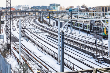 Rail tracks and trains covered by snow in London