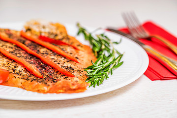 Roasted fish fillet with vegetables close