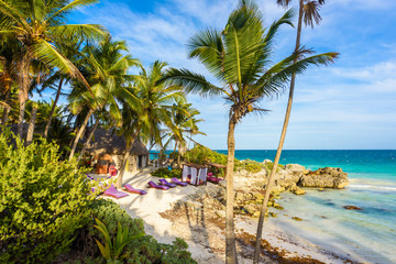 Obraz na płótnie Canvas Recreation at paradise beach resort with turquoise waters of Caribbean Sea at Tulum, close to Cancun, Riviera Maya, tropical destination for vacation, Mexico
