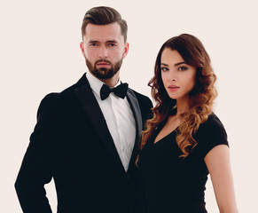 Portrait of a handsome man looking at the camera with a woman