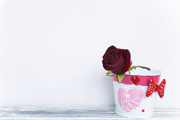 red rose in decorative bucket background
