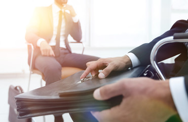 Obraz premium Elegant man in suit with briefcase