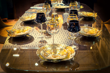 Table setting of luxurious glasses and plates