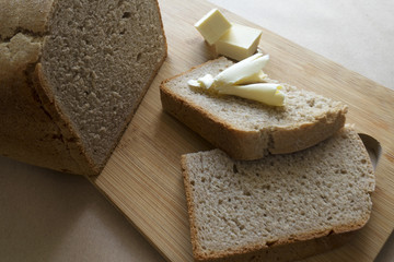 homemade bread on a board with butter