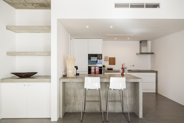 modern kitchen with gray tile floor and white wall