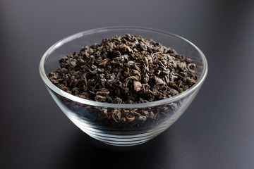 black tea leaves in glass bowl