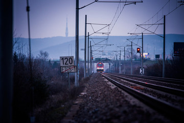 Plakat Train ride on the track in dark evening light, travel, transport photo