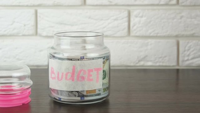 Budget. Glass jar with cash.