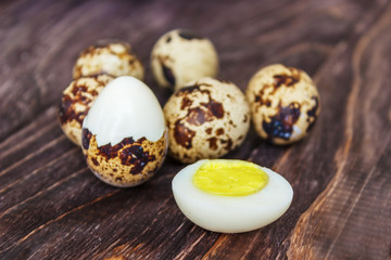 Fototapeta premium Quail eggs on a wooden table, a symbol of the Easter season. Healthy eating.