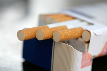 Close up of cigarettes; addiction and health concept; selective focus background.