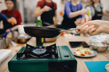 Cheese is fried on cast-iron frying pan, fried cheese, preparation of snacks