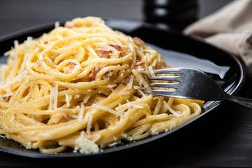 Spaghetti carbonara with egg and pancetta