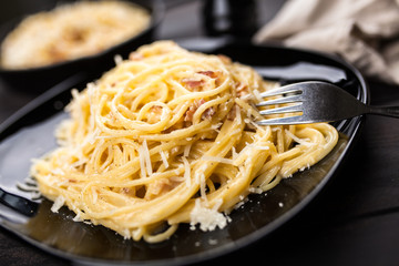Spaghetti carbonara with egg and pancetta