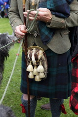 A Scottish man with an unusual sporran featuring a badgers head wearing a traditional kilt and...