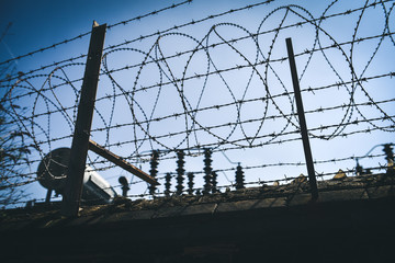 a dangerous fence of barbed wire
