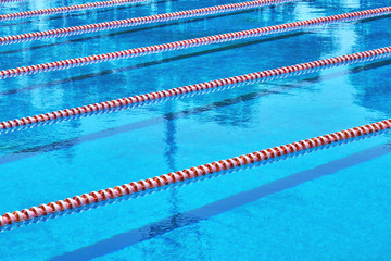 Municipal swimming sport pool. Texture of blue water in the pool. Bright abstract background ideal for any design             - 194483651