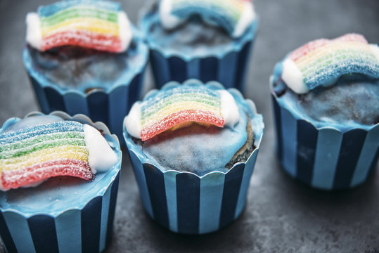 Food: Blueberry Muffin with blue icing, clouds and rainbow