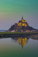 Saint Michel famous castle with water reflection. France