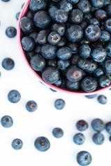 Looking down from above onto a fresh, organic bowlful of blueberries