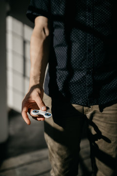 Man Holding A Fidget Spinner Stress Reliever
